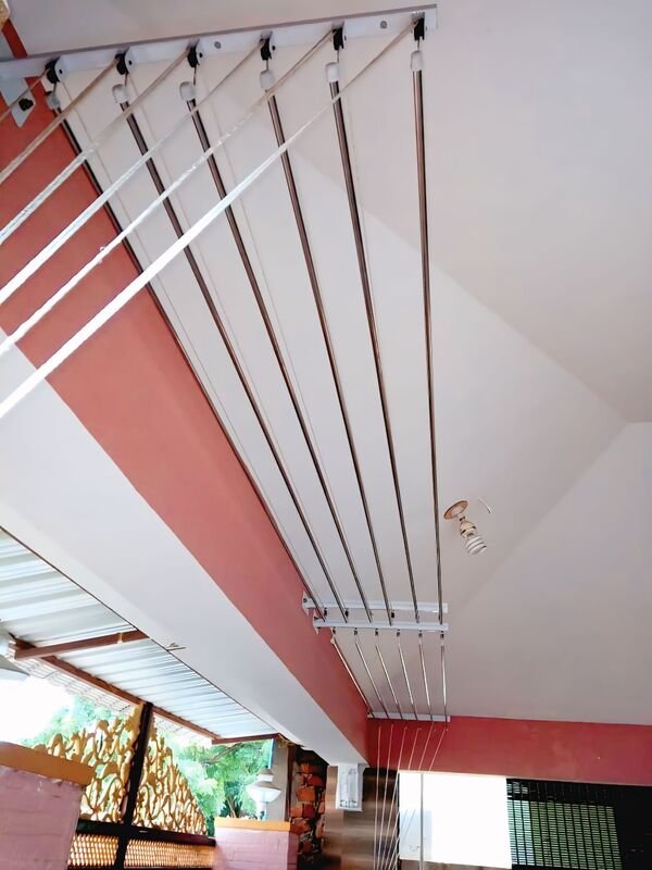 Cloth hangers installed on apartment balcony in Hyderabad - laundry drying system by JNS